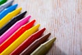 Set of multicolored wax crayons on wooden surface Royalty Free Stock Photo