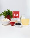 A set of natural products rich in calcium. Healthy food concept. Cardboard sign with the inscription.