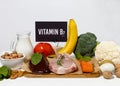 A set of natural products rich in vitamin B7 biotin. Healthy food concept. Cardboard sign with the inscription.