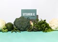 A set of natural products rich in vitamin K. Healthy food concept. Cardboard sign with the inscription.