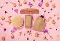 Set of natural soap, aroma oil, wooden comb  and body massage brush with dried rose and orchid buds as a decoration Royalty Free Stock Photo