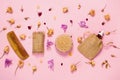 Set of natural soap, aroma oil, wooden comb  and body massage brush with dried rose and orchid buds Royalty Free Stock Photo
