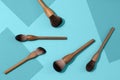 Set of natural wood vegan make up brushes on sky blue background. Top view, copy space. Royalty Free Stock Photo