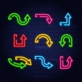 Set of neon frame star arrows pointers signs light electric banners glowing on black brick wall background Royalty Free Stock Photo