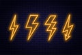 Set of neon lightning bolt signs. Neon sign of electricity or high-voltage symbol on brick wall background