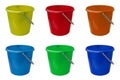 Set of new, classic, plastic buckets. Green, yellow, blue, red, orange and light blue bucket isolated on a white background Royalty Free Stock Photo