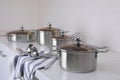 Set of new clean cookware and utensils on countertop in kitchen Royalty Free Stock Photo