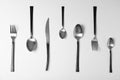 Set of new metal cutlery on white background Royalty Free Stock Photo
