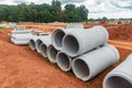 Set of new pipes stacked on yellow clay at a construction site Royalty Free Stock Photo