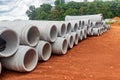 Set of new pipes stacked on yellow clay at a construction site Royalty Free Stock Photo