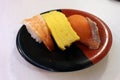 Nigiri sushi of ebi (shrimp or prawn), fish, and egg