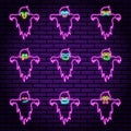A set of nine neon signs in the form of ghosts, in purple, with different emotions. Against the background of a brick wall.