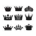 Set of nine vector black silhouettes of crowns isolated on a transparent background. Royalty Free Stock Photo