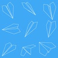 Set of nine vector illustrations of paper plane icons. Outline simple craft paper airplane isolated on blue background Royalty Free Stock Photo