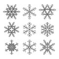 Set of nine vector simple linear snowflakes icons. Hipster black and white design elements. Royalty Free Stock Photo