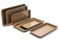 Set of nonstick baking trays for versatile cooking Royalty Free Stock Photo