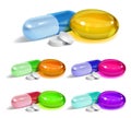 Set of oblong and elliptical multicolored capsules and white round pills