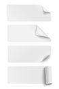 Set of oblong white sticky paper pieces. One piece has rolled end and others have curled corners  with shadow isolated on white Royalty Free Stock Photo