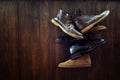 Set of old boots hanging on the nail Royalty Free Stock Photo