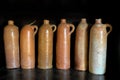 Set of old ceramic bottles used for burning water Royalty Free Stock Photo