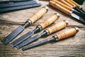Set of old chisels on a wooden Royalty Free Stock Photo