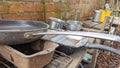 A set of old rusty pans and pots in a childs outdoor mud kitchen Royalty Free Stock Photo