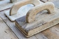 Set of old used trowels on a rough wooden surface Royalty Free Stock Photo