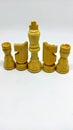 Set of old wooden black and white chess board game pieces Royalty Free Stock Photo