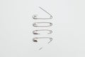 Set of safety pins on white background Royalty Free Stock Photo