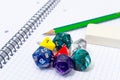 Set of open exercise book, pencil, rubber and dices isolated on Royalty Free Stock Photo