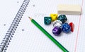 Set of open exercise book, pencil, rubber and dices on Royalty Free Stock Photo