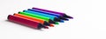 Set of open felt-tip pens of different colors close-up. Side view