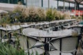 Set outdoor restaurant tables in London, UK, selective focus