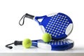 Set of paddle tennis rackets and balls on table isolated Royalty Free Stock Photo