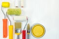 Set of paint brushes, rollers and other tools on white wooden ba Royalty Free Stock Photo