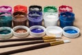 Set of paints for painting with brushes. Acrylic paints in tubes. Old paint in bottles. Royalty Free Stock Photo