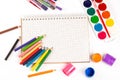 A set of paints, pencils, brushes for drawing and a notebook on white Royalty Free Stock Photo