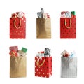 Set of paper shopping bags with gifts on background Royalty Free Stock Photo