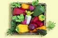 Set of paper vegetables in wicker tray