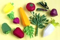 Set of paper vegetables on yellow background