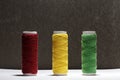 Set of pastel colors thread for sewing on a black background. Set of threads on bobbins retro style. Vintage accessories for sewin Royalty Free Stock Photo