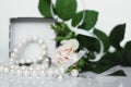 Set of pearl jewellery in gift box with flowers Royalty Free Stock Photo