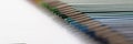 Set of pencils perfectly arranged in line on white surface for childs art Royalty Free Stock Photo