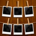 Set of photo frames on the rope with clothespin. Photo frames set on wood Royalty Free Stock Photo