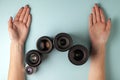 Set of photo lenses on a colored background, the selection and comparison of photographic equipment, hands are holding photo Royalty Free Stock Photo