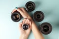 Set of photo lenses on a colored background, the selection and comparison of photographic equipment, hands are holding photo Royalty Free Stock Photo