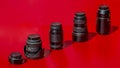 Set of photographic lenses isolated on red background Royalty Free Stock Photo