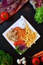 Deep Fried Chicken Breast with Mushrooms, Vegetables and French Fries Royalty Free Stock Photo