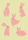 A set of pink easter rabbits on a green background