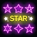 Set of pink star neon lighting isolated on brick wall background. Stars neon sign. Vector. Royalty Free Stock Photo